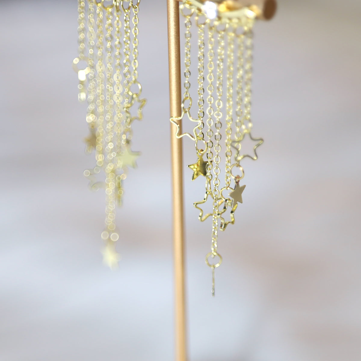 Gold Star Dangle Clubbing Earrings