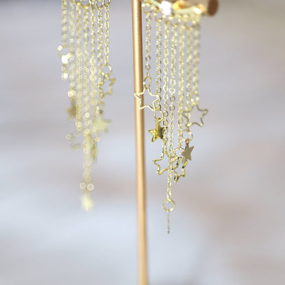 Gold Star Dangle Clubbing Earrings