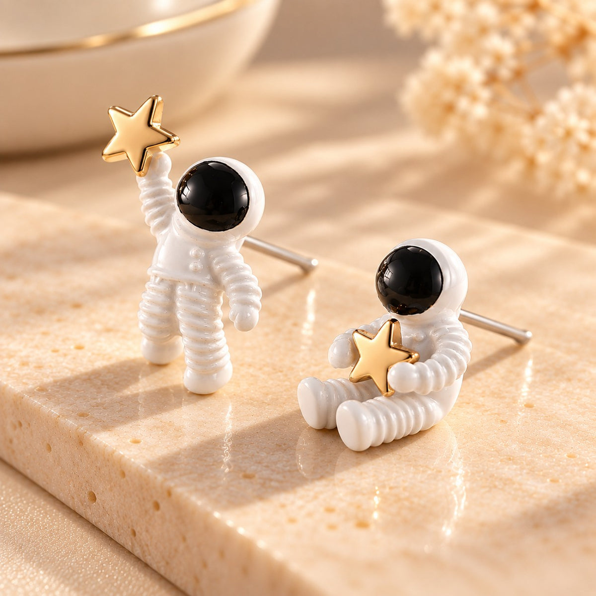 Astronaut star stud earrings with 925 sterling silver posts on stone