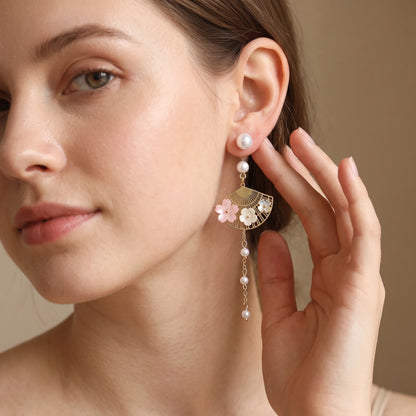 Model wearing cherry blossom fan dangle earring