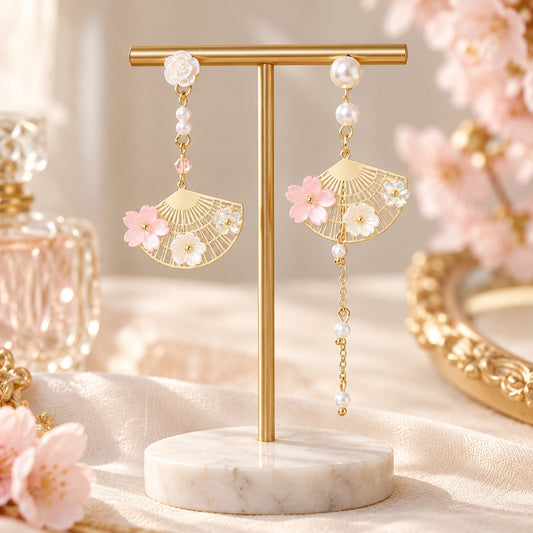 Pink sakura gold fan earrings with pearl chain on stand