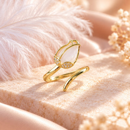 Gold tulip ring with white opalescent bloom on pink stone