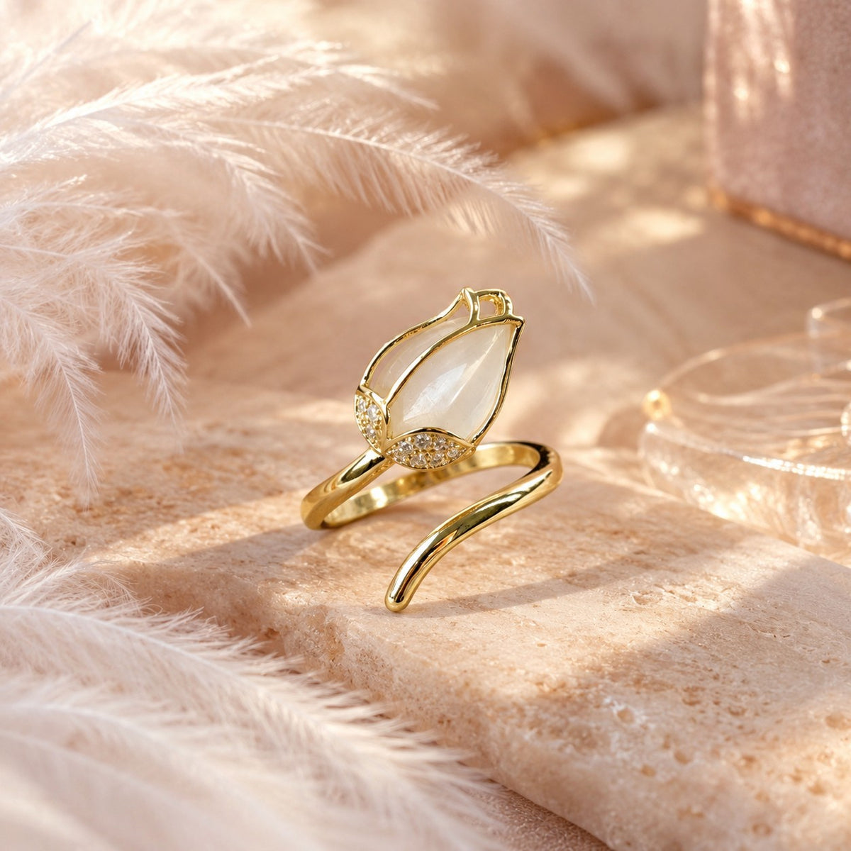 Gold opalescent tulip ring with crystals in soft light
